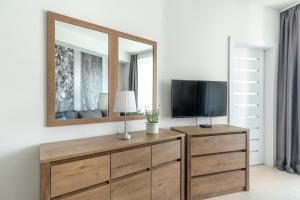 Televízia a/alebo spoločenská miestnosť v ubytovaní Spa Residence Carbona Hévíz Apartments KAKADU 203 B