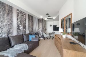 Televízia a/alebo spoločenská miestnosť v ubytovaní Spa Residence Carbona Hévíz Apartments KAKADU 203 B