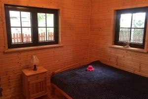 Кровать или кровати в номере Siedlisko Czarny Bocian