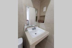 a bathroom with a sink and a toilet at Casa en Mahahual cerca de la playa D1 in Mahahual