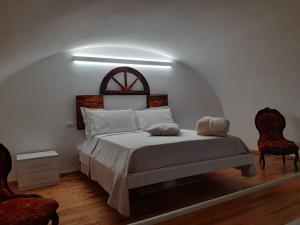Un ou plusieurs lits dans un hébergement de l'établissement Palazzo Grandori Alloggi Turistici