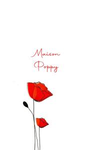 a picture of two red flowers with the words manson purple at Maison Poppy in Aosta