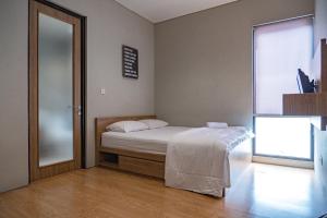 Voodi või voodid majutusasutuse Three J Residence 2 toas