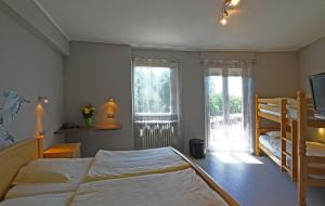 Postel nebo postele na pokoji v ubytování Hotel Champ Alsace