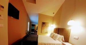 Postel nebo postele na pokoji v ubytování Hotel Ceres