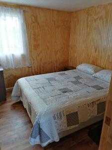 Postel nebo postele na pokoji v ubytování Cabaña María Quinchen