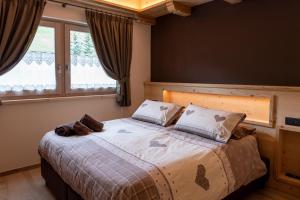 Postel nebo postele na pokoji v ubytování AG Apartments Livigno centro