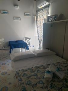 Posteľ alebo postele v izbe v ubytovaní La casa nella Torretta