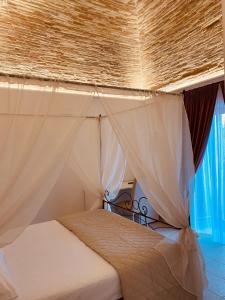 A bed or beds in a room at RELAIS SAN MARCO LUXURY GUEST HOUSE