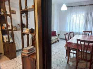 a kitchen and dining room with a table and chairs at Apartment with view at Olympus mountain in Litochoro