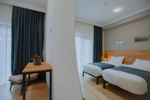 Letto o letti in una camera di Northgate Hotel Kazbegi
