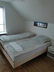 Postel nebo postele na pokoji v ubytování Korsør Room