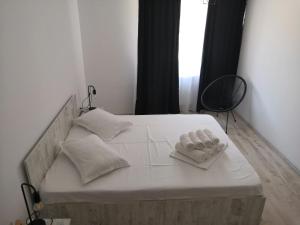 
Un pat sau paturi într-o cameră la Apartament Dolce Vita
