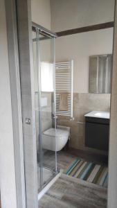 a bathroom with a toilet and a sink at La Terra Buona guest house in Villa San Secondo