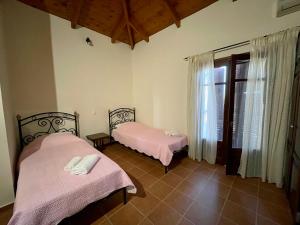 Postel nebo postele na pokoji v ubytování Serenita Cottage