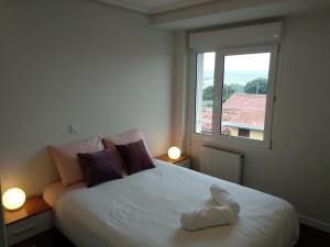 Postel nebo postele na pokoji v ubytování Bonito duplex cerca de la playa y de Santander