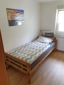 Postel nebo postele na pokoji v ubytování Ulmer Münster Blick