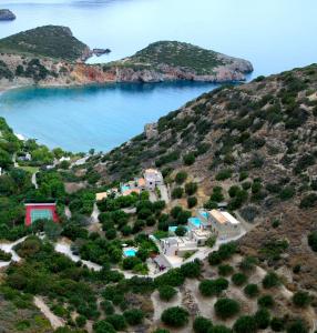 an aerial view of a house on a hill with water at Istron Luxury Villas in Istron