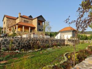a house on a hill with a stone wall at Maurice Bonjean in Ifrane