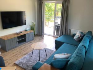 TV a/nebo společenská místnost v ubytování Apartament Baltic Residence Pobierowo
