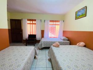 Cama o camas de una habitación en Hotel La Puesta Del Sol B&B