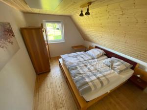 Ένα ή περισσότερα κρεβάτια σε δωμάτιο στο Grimm´s Landhaus