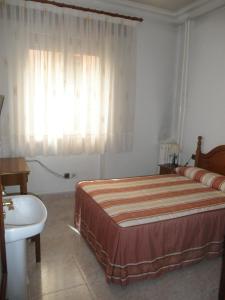 Postel nebo postele na pokoji v ubytování Hostal Los Andes