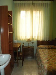 Postel nebo postele na pokoji v ubytování Hostal Los Andes