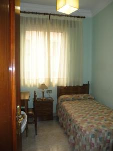Postel nebo postele na pokoji v ubytování Hostal Los Andes