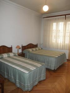 Postel nebo postele na pokoji v ubytování Hostal Los Andes