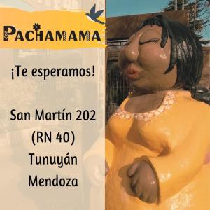 a sign with a statue of a woman at Departamentos Pachamama in Tunuyán