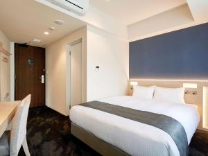 Ένα ή περισσότερα κρεβάτια σε δωμάτιο στο Hotel Keyaki Gate Tokyo Fuchu