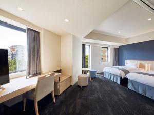 Ένα ή περισσότερα κρεβάτια σε δωμάτιο στο Hotel Keyaki Gate Tokyo Fuchu