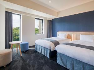 Ένα ή περισσότερα κρεβάτια σε δωμάτιο στο Hotel Keyaki Gate Tokyo Fuchu