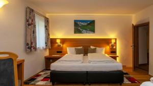 Postel nebo postele na pokoji v ubytování Apart Alpin Oetztal