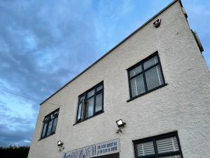 a building with four windows on the side of it at The Hideout in Anderby