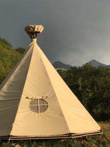 a white tent sitting on top of a hill at @Logovo_Sovi in Almaty