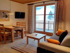 Μια τηλεόραση ή/και κέντρο ψυχαγωγίας στο Appartements gosaukamm.com