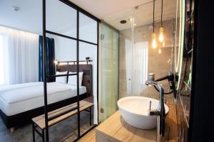 Posteľ alebo postele v izbe v ubytovaní H2 Hotel Budapest