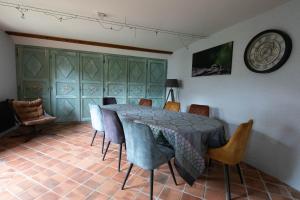 a dining room with a table and chairs at le Relais des Bornes - Gîte & Spa in Villy-le-Bouveret