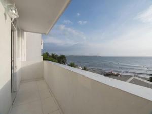 a white balcony with a view of the ocean at PLAYA LAGUITO in Cartagena de Indias