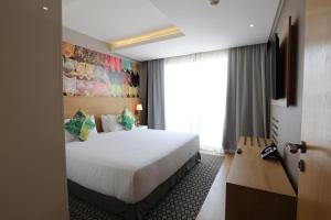 Ein Bett oder Betten in einem Zimmer der Unterkunft Mid Town Hotel Casablanca