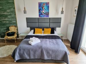 Posteľ alebo postele v izbe v ubytovaní Apartment Jana Kazimierza Wola by Noclegi Renters