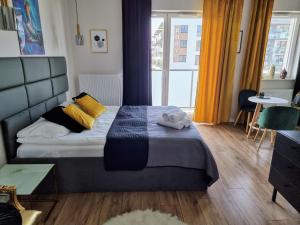 Кровать или кровати в номере Apartment Jana Kazimierza Wola