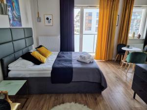 Posteľ alebo postele v izbe v ubytovaní Apartment Jana Kazimierza Wola by Noclegi Renters