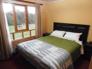 Postel nebo postele na pokoji v ubytování Agroturismo Coñico
