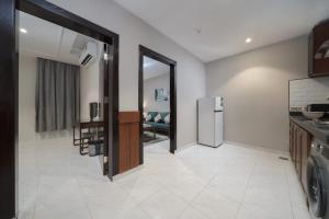 Kuchyň nebo kuchyňský kout v ubytování Biz Hotel Apartments