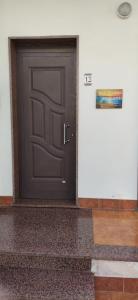 a black door with a sign on it in a room at Sealand in Nunziata