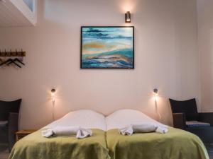 מיטה או מיטות בחדר ב-Oldfruen - Rooms & Apartments