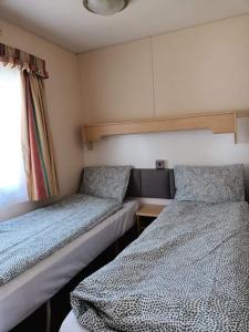 Posteľ alebo postele v izbe v ubytovaní OSADA Pod Brzozą